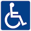 Handicapped Accessible Sign featuring a white wheelchair symbol  on a blue background